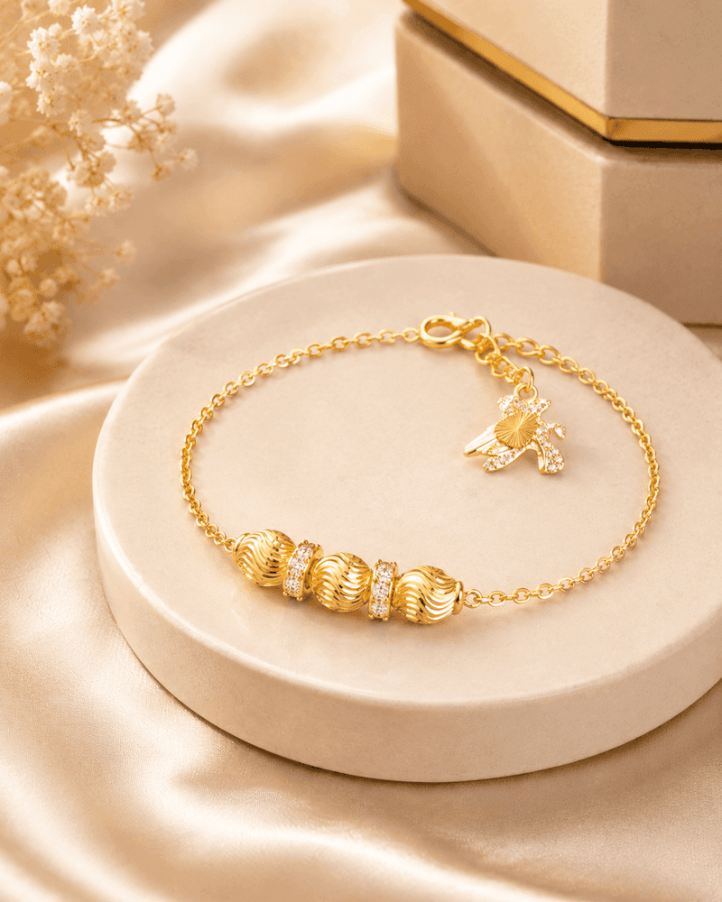 Lắc Tay Vàng Bi Xoắn Charm Nơ – Kim Điệp — Vàng tây 10K